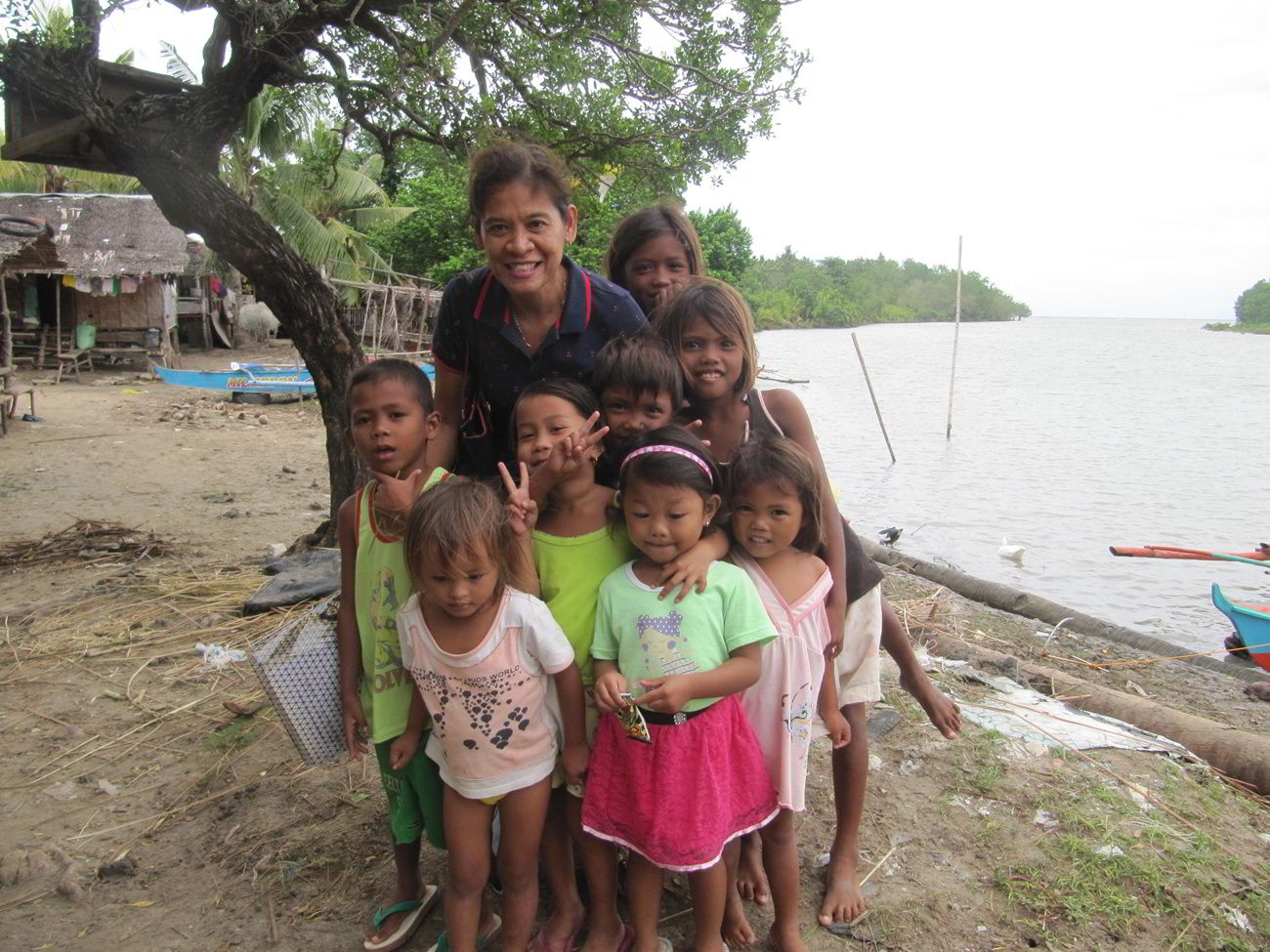 Gigi Brown with the children of Sitio Baybay, Barangay San Isidro, Tanjay City, Philippines