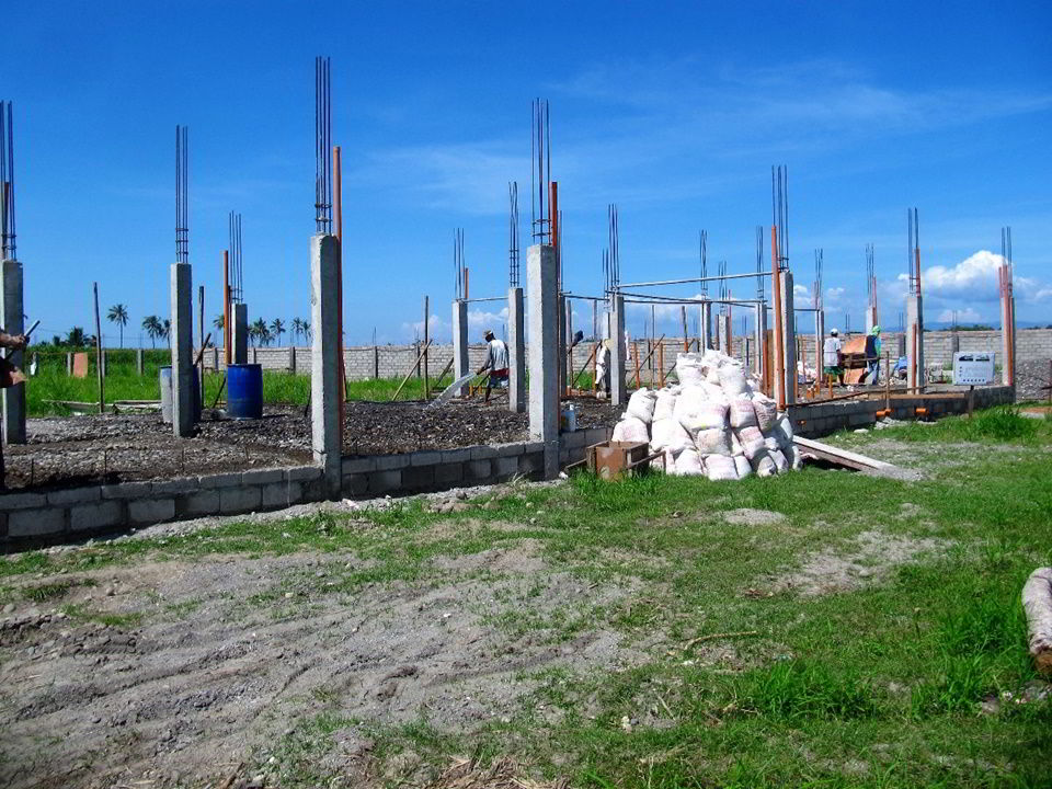 Photo showing elevated foundation of building to mitigate against flooding