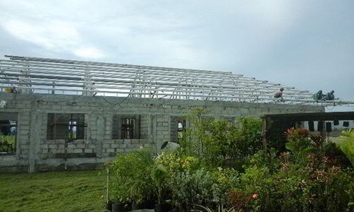 Children's home work progress showing trusses being installed