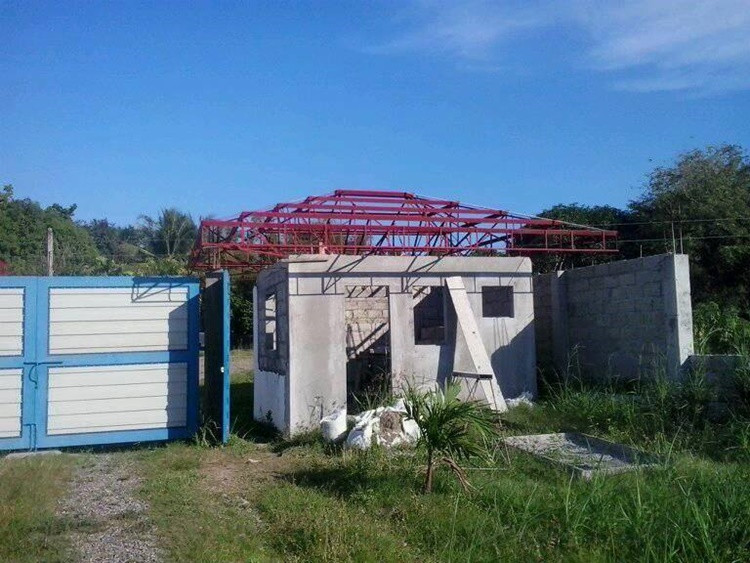 guardhouse roof under construction at cea orphanage site