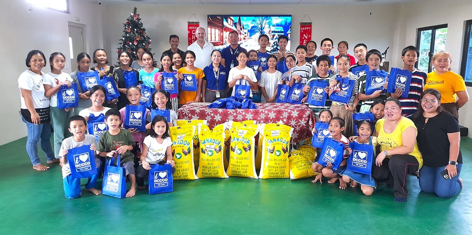 Receiving food donations from DCCCO during the CEA Christmas 2024 celebrations.